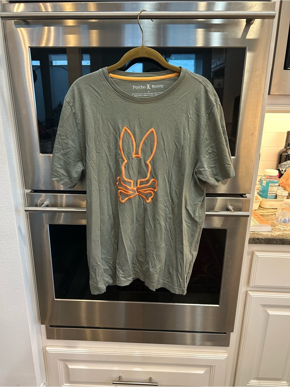 Psycho Bunny Olive Green tee size psycho bunny 6 has wear stains